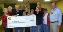 Photo of sunrise rotary club with the donation check. 
