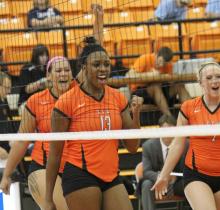 Attached are action shots of Tatiana Booth playing volleyball at East Central University