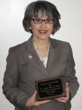 Photo of Dr. Diana Watson-Maile with her award. 