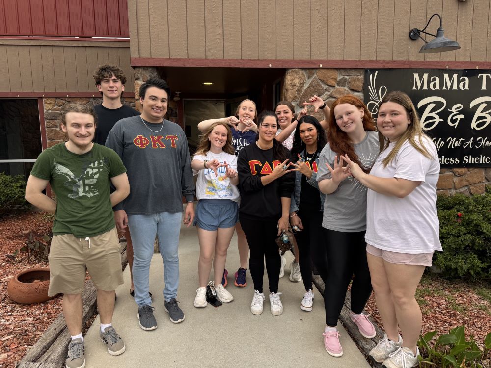 Greek students dropping off donations