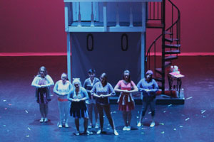 Actors dancing on stage