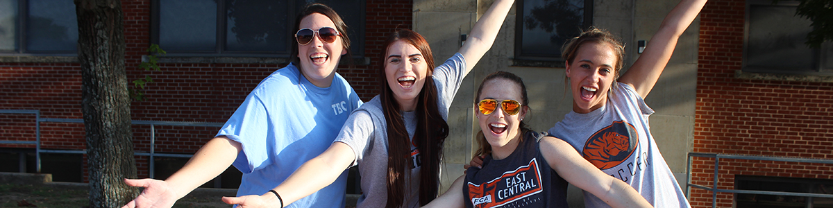 ECU students smiling on campus.