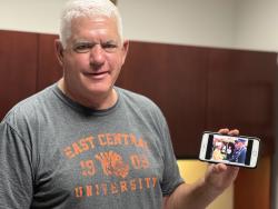 Dr. Steve Gardner shows a picture of when he was presented to the Queen of England circa 1989.