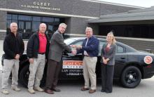 Photo of group receiving car.