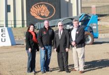 Four ECU representatives stand near where the north end zone goalpost has been removed in preparation for the installation of new turf at East Central University’s Norris Field.