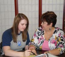 Bethany Beachel, a biology major and graduate student from Henryetta, meets with McNair Scholars Program Director Pat Sutton.