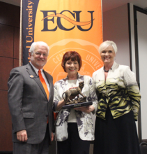 Billie Thrash accepts Distinguished Alum Award for husband William C. Thrash