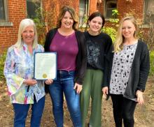 Pictured, from left, with the City of Ada proclamation in hand are Pamla Armstrong, assistant director; Georgiana Sullivan, child care consultant; Dallyn Sullivan, student worker; and Lindsay Christian, infant/toddler specialist. 