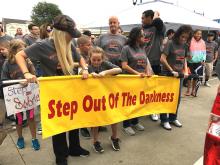 Participants in a previous year’s “Step Out of the Darkness” event gather in preparation for the march from the Pontotoc County Courthouse down Main Street to ECU’s Centennial Plaza. 