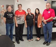 Pictured are ECU professors Dr. Jessica Brumley (left), Dr. Christine Pappas, and Dr. Robin Roberson, Megan Hawley, and Dr. Saba Tahmassebi (right) at Ada High School.