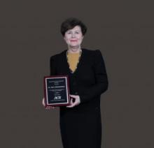 Dr. Mara Sukholutskaya receiving her award