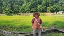 East Central University student Cas Northcutt is pictured in costume at the Mount Vernon Demonstration Farm as part of the Historic Trades Internship.