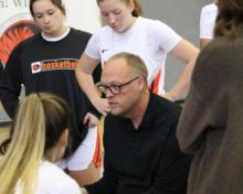 Coach Matt Cole with the Women's Basketball Team