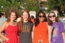 E C U students pose for the camera outdoors in front of Science Hall