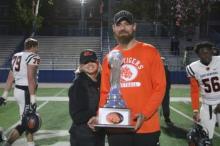 Coach Al Johnson with trophy