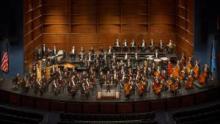 Overview of O K C Philharmonic shown on stage