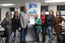 Group picture with Ada Mayor Randy McFarlin presenting Pamla Armstrong with proclamation