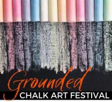 Grounded Chalk Art Festival text over chalk rainbow