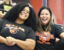 Two female students smile for the camera