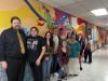 Art students pose in front of a mural they completed over the course of two semesters at East Central University.